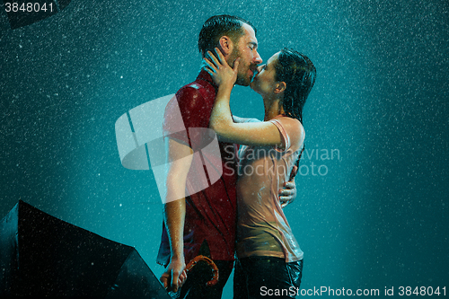 Image of The loving couple in the rain