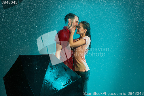 Image of The loving couple in the rain