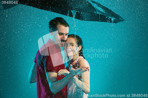 Image of The loving couple in the rain