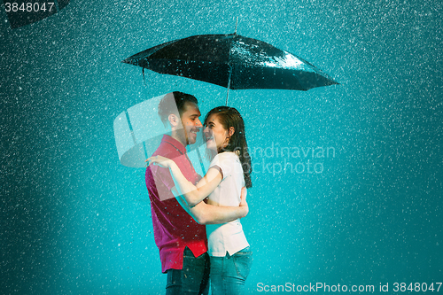 Image of The loving couple in the rain