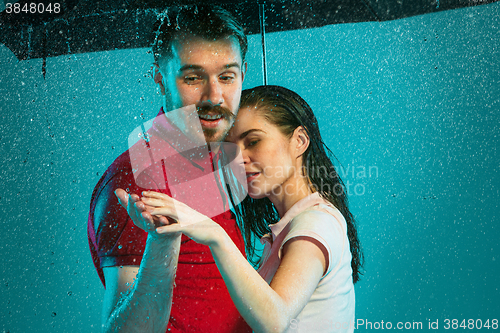 Image of The loving couple in the rain