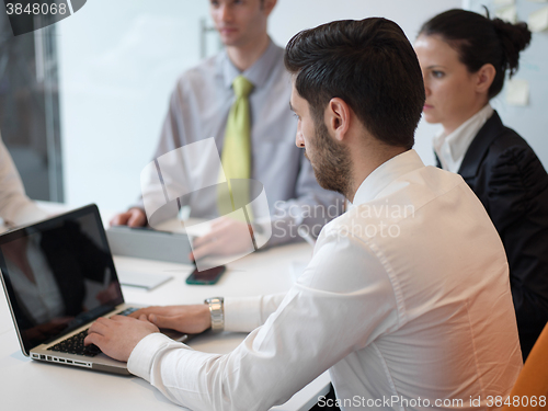 Image of group of young business people  on meeting at modern startup off