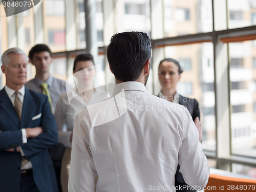 Image of business leader making presentation and brainstorming