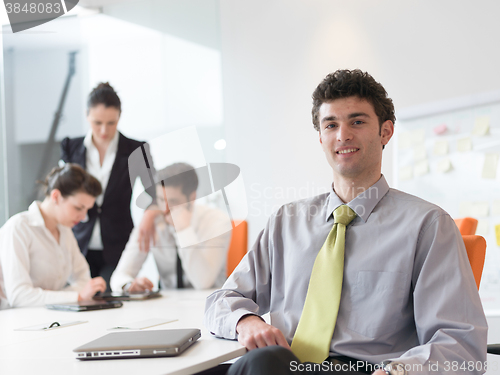 Image of group of young business people  on meeting at modern startup off
