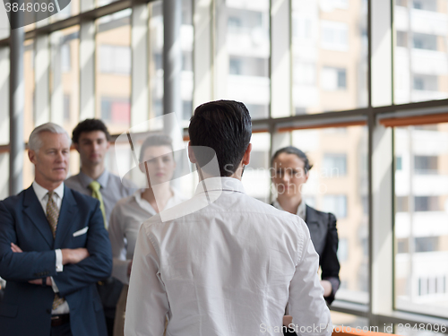 Image of business leader making presentation and brainstorming