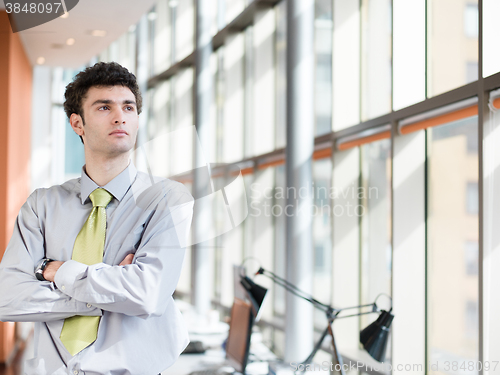 Image of portrait of young business man at modern office