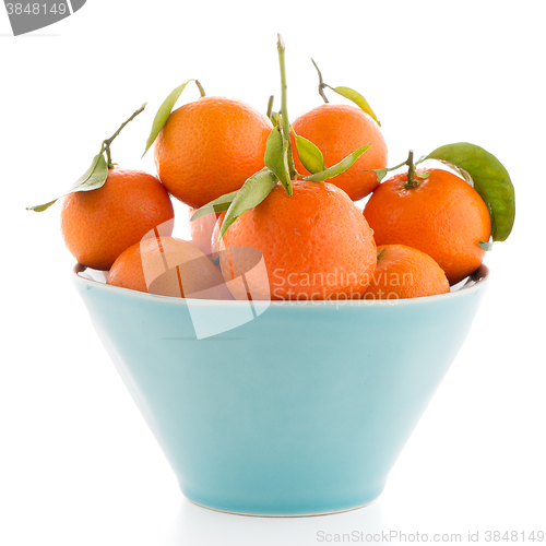 Image of Tangerines on ceramic blue bowl 