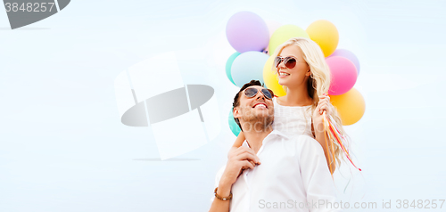 Image of couple with colorful balloons