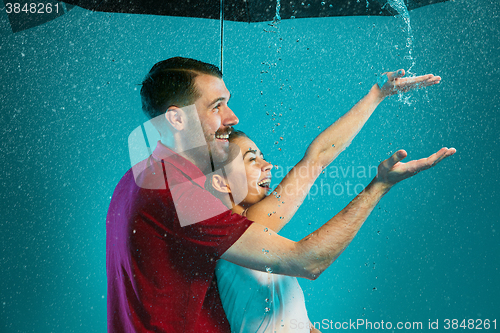 Image of The loving couple in the rain