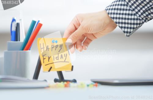 Image of Happy Friday text on adhesive note