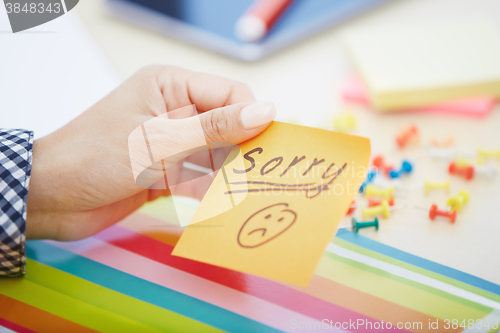 Image of Sorry text on adhesive note