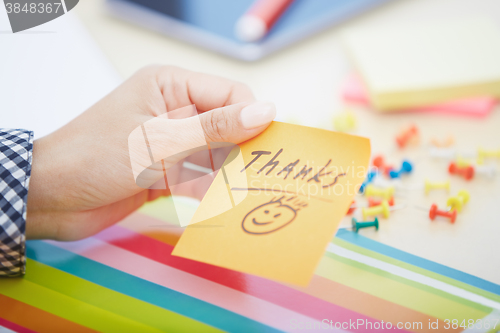 Image of Thanks text on adhesive note