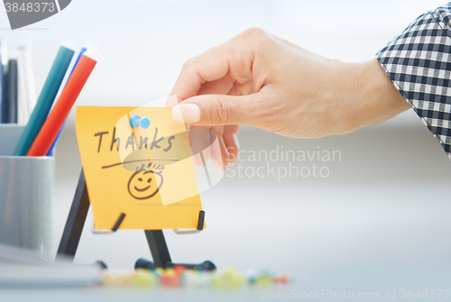 Image of Thanks text on adhesive note