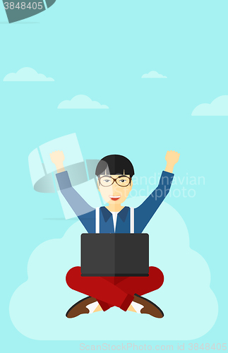 Image of Man sitting on cloud with laptop.