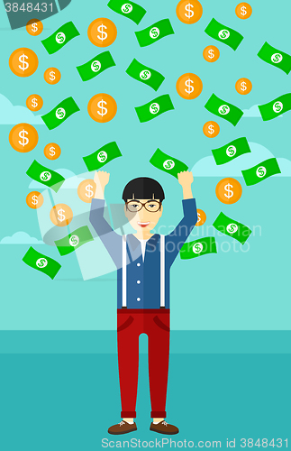 Image of Happy man with  flying money. 