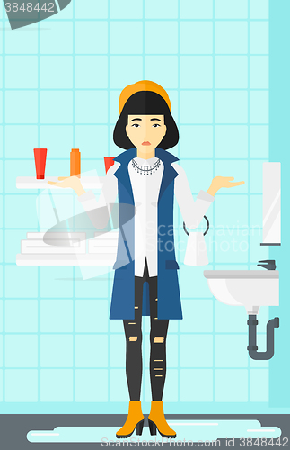 Image of Woman in despair standing near leaking sink.