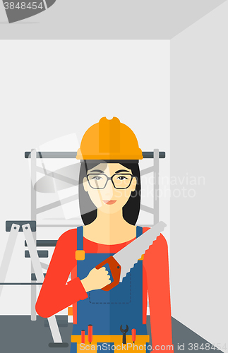 Image of Smiling worker with saw.