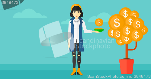 Image of Woman catching dollar coins.