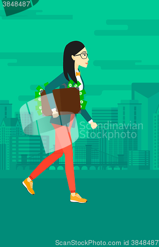 Image of Woman with suitcase full of money.