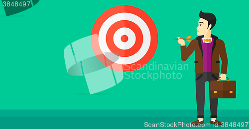 Image of Businessman with target board.