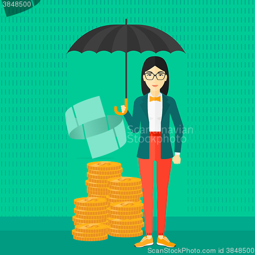 Image of Woman with umbrella protecting money.