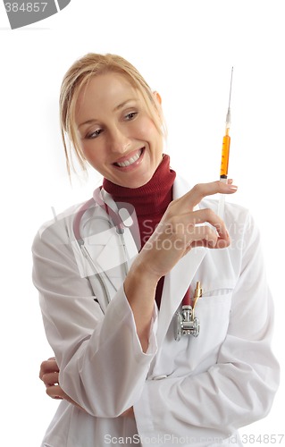 Image of Physician or vet holding needle syringe