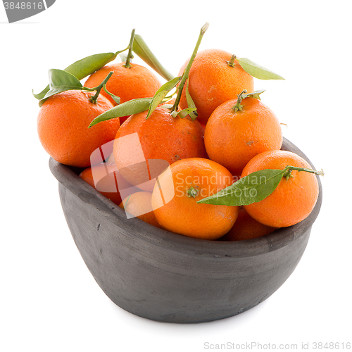 Image of Tangerines on clay bowl 