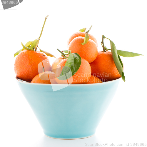Image of Tangerines on ceramic blue bowl 