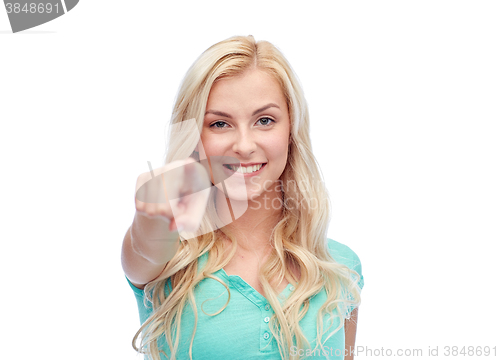 Image of happy young woman pointing finger to you