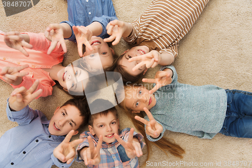 Image of happy children showing peace hand sign