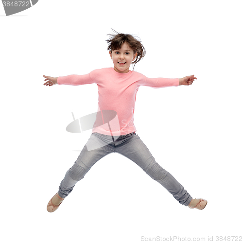 Image of happy little girl jumping in air