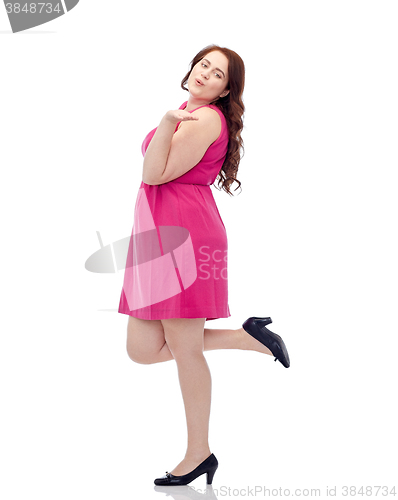 Image of happy young plus size woman and sending blow kiss