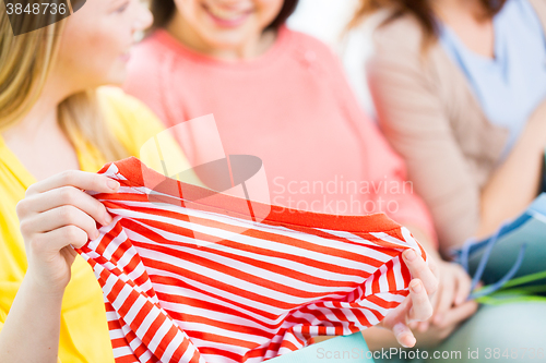 Image of close up of happy teenage girls with shirt