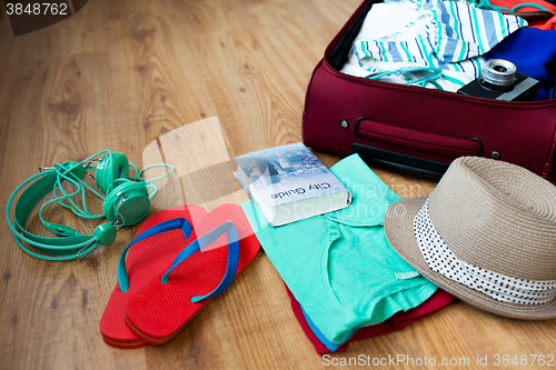 Image of close up of travel bag with clothes and stuff