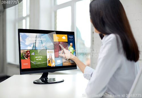 Image of close up of woman with news on computer in office