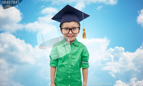 Image of happy boy in bachelor hat or mortarboard