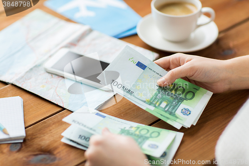 Image of close up of traveler hands counting euro money