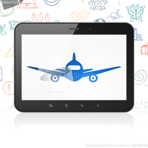 Image of Travel concept: Tablet Computer with Aircraft on display