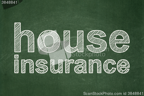 Image of Insurance concept: House Insurance on chalkboard background