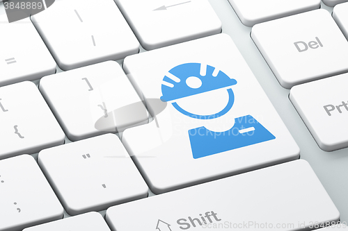 Image of Manufacuring concept: Factory Worker on computer keyboard background
