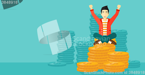 Image of  Happy businessman sitting on coins.