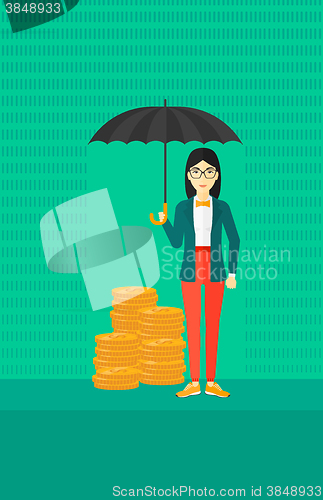 Image of Woman with umbrella protecting money.