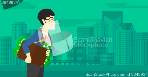 Image of Man with suitcase full of money.