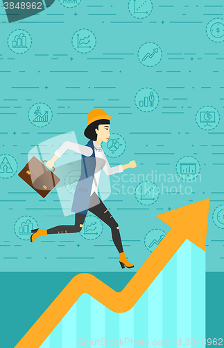 Image of Woman running on growth graph. 