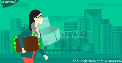 Image of Woman with suitcase full of money.