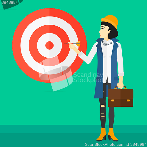 Image of Business woman with target board.