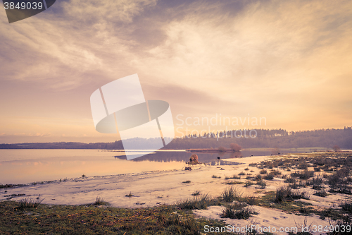 Image of Frozen lake landscape in the sunset