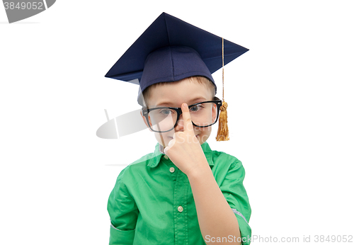 Image of happy boy in bachelor hat and eyeglasses