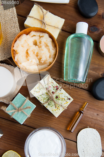 Image of close up of body care cosmetic products on wood