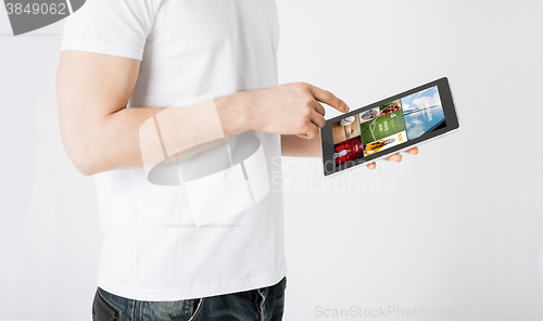 Image of close up of man with tablet pc and web pages